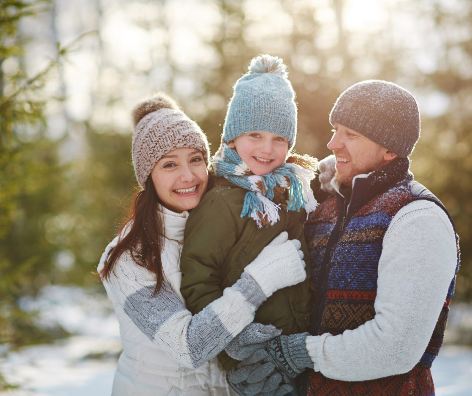Family in a snowy forest